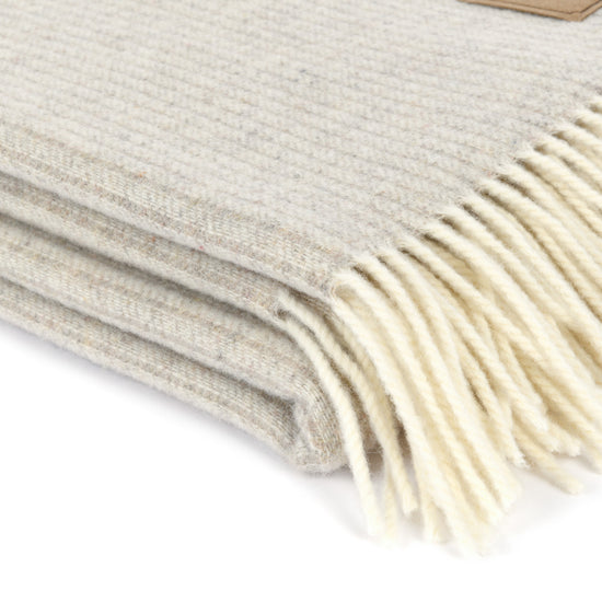 
                  
                    Lammwollplaid mit feinen Streifen "LUZERN"
                  
                