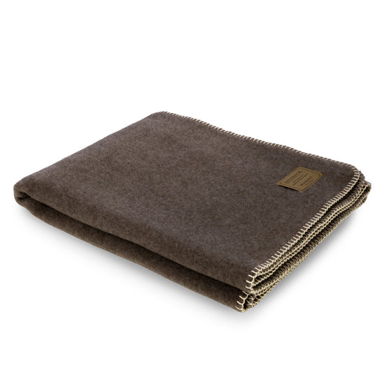 
                  
                    Kniedecke aus Lammwolle "GABUN"
                  
                